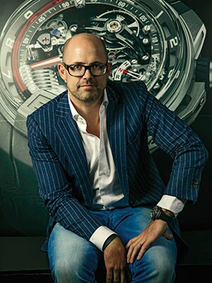 Water works: HYT co-founder Vincent Perriard (with an H2 watch in the background) is expanding the business to include lower-priced timepieces with increased production