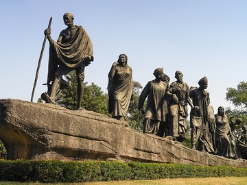 What Gandhi believed is the purpose of a corporation