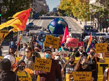 Biden, with powerful allies and foes, targets climate change