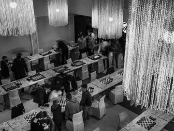 The dark side of Chess: Payoffs, points and 12-year-old grandmasters