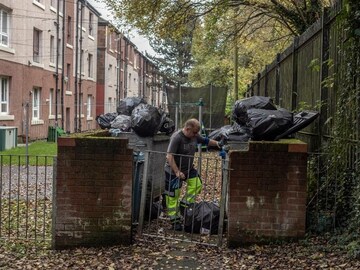Outside climate summit, trash in Glasgow piles high