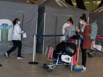 Will the vaccines stop Omicron? Scientists are racing to find out