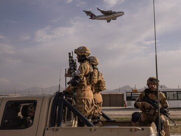 From Afghanistan to the World Cup, tiny, wealthy Qatar steps up