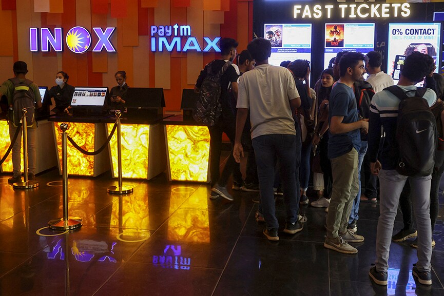 People wait to buy tickets at an INOX movie theatre in Mumbai, India, March 29, 2022.
Image: Francis Mascarenhas / Reuters