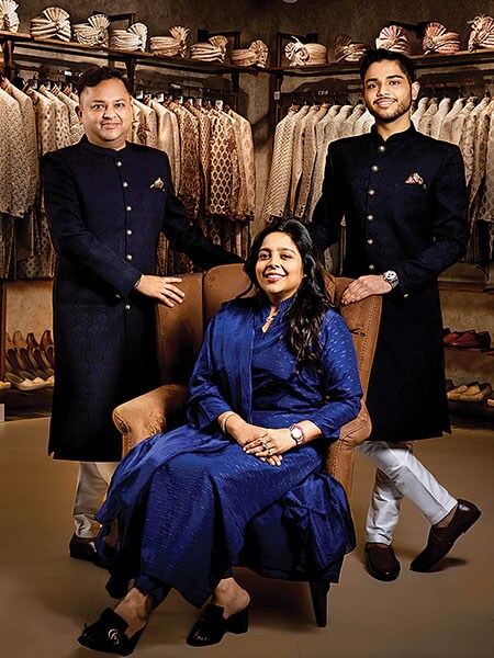 Modi with his wife Shilpi (seated) and son Vedant (right)