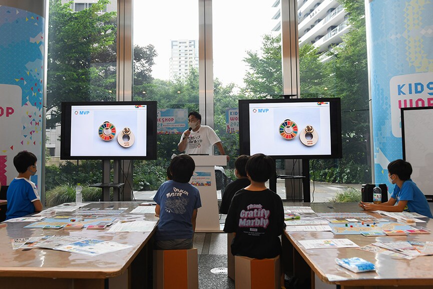 Logos promoting the United Nations’ Sustainable Development Goals campaign on screens at a workshop for children in Tokyo, Aug. 17, 2022. With the support of Japan’s biggest business federation, Keidanren, the country has embraced the U.N. campaign to aspire to become a better place by ending poverty, improving education and reducing inequality. (Noriko Hayashi/The New York Times)