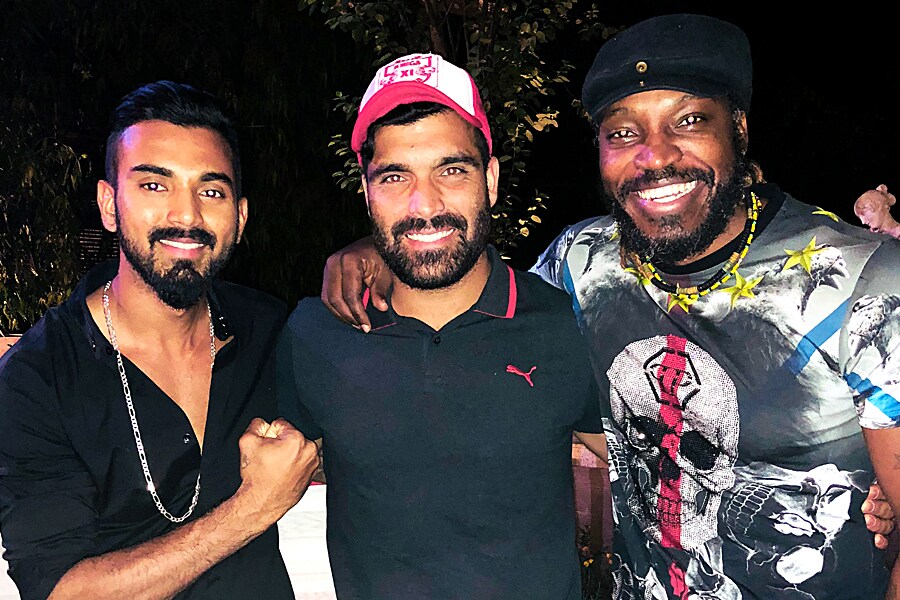 Manzoor Dar (M) with Kl Rahul (L) and Chris Gayle (R) at a after party during the IPL 2018.
Image: Courtesy Manzoor Dar