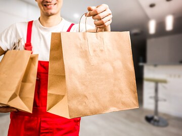 From the United States to South Korea, which country charges the most for restaurant home delivery?