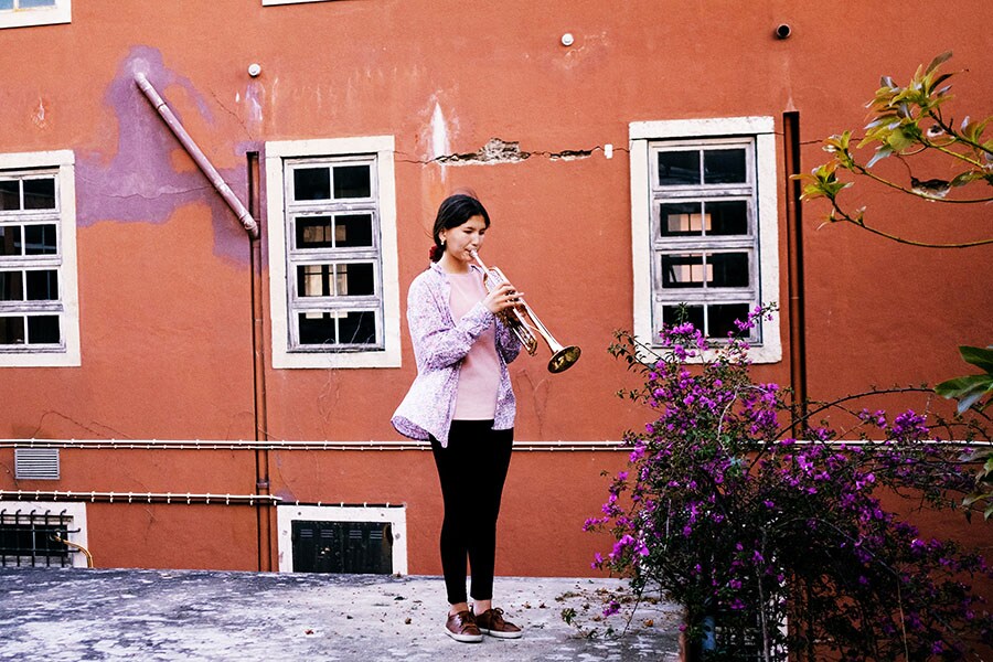 Zohra Ahmadi plays trumpet at the Afghanistan National Institute of Music compound, in Lisbon, Portugal, on May 8, 2022. Ahmadi was convinced from a young age that she wanted to be a professional musician. (Isabella Lanave/The New York Times)