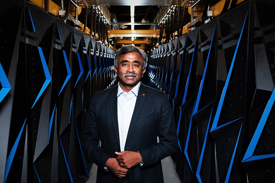 Thomas Zacharia, director of the Oak Ridge National Laboratory, with an earlier supercomputer at the lab in Oak Ridge, Tenn., June 6, 2018. The United States has regained a coveted speed crown in computing with a powerful new supercomputer in Tennessee, a milestone for the technology that plays a major role in science, medicine and other fields. 
