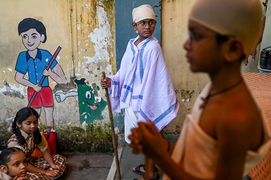 Boys dressed up as India's independence icon Mahatma Gandhi attend an event to celebrate Gandhi’s birth anniversary at a school in Mumbai on October 2, 2022.
Image: Punit PARANJPE / AFP