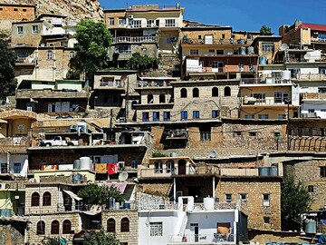 As Iraq's concrete jungle swelters, ancient stone houses stay cool