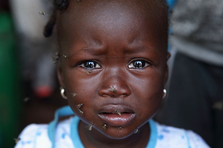 A Malian girl is seen as daily life amid poverty continues at Faladie camp in West African country Mali's capital Bamako on June 25, 2022. Image: Kemal Ceylan/Anadolu Agency via Getty Images

