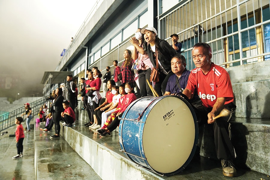 Families with young children and grandparents cheer with chants and drums at the Rajiv Gandhi stadium during a match in September
Image: Mexy Xavier