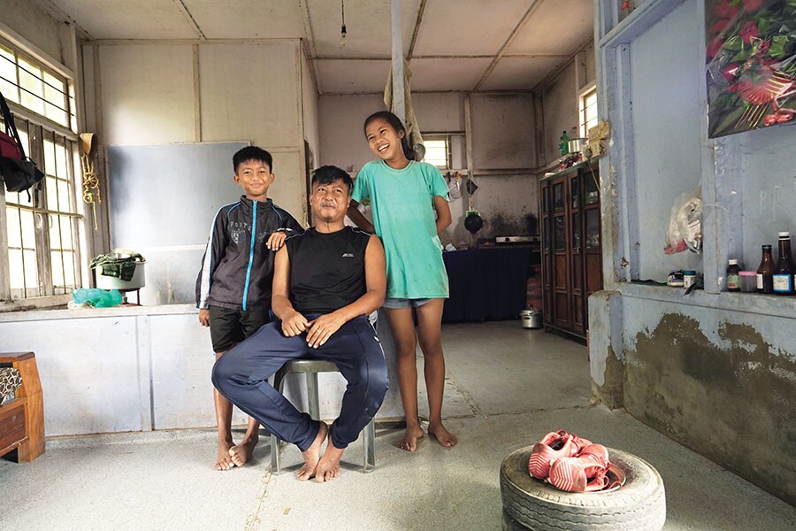 Lalchawiliana with his daughter Vanlalnghaki (13) and son Lalthazuala (12) in their one-bedroom quarter in Kolasib district. He ensures that Lalthazuala attends football lessons thrice a week
Image: Mexy Xavier