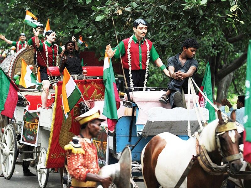 A procession with statues of the Mohun Bagan team that won the IFA Shield at a celebration rally in Kolkata on July 29, 2011. The day is celebrated every year as ‘Mohun Bagan Day’
Image: Dibyangshu Sarkar / AFP