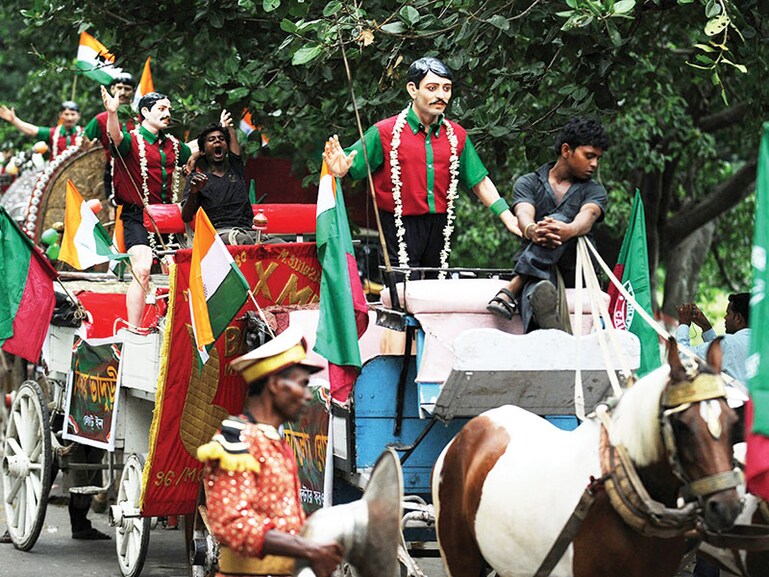 A procession with statues of the Mohun Bagan team that won the IFA Shield at a celebration rally in Kolkata on July 29, 2011. The day is celebrated every year as ‘Mohun Bagan Day’
Image: Dibyangshu Sarkar / AFP