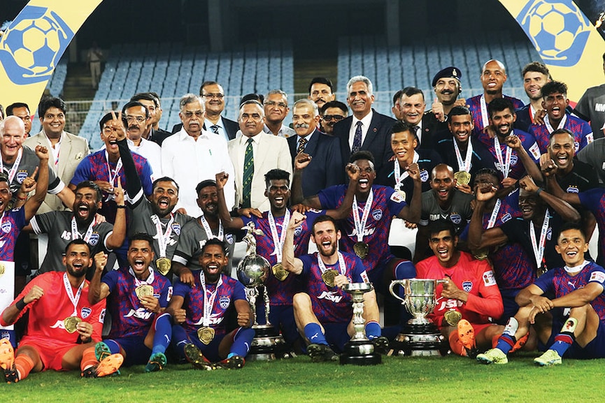 Bengaluru FC Captain Sunil Chhetri (seated, extreme right) celebrates with teammates after  defeating Mumbai City FC to win the Durand Cup at the Salt Lake stadium in Kolkata
Image: Debajyoti Chakraborty/Nurphoto Via Getty Images