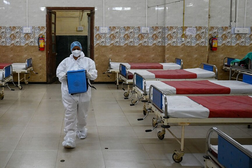 A health worker wearing personal protective equipment (PPE) takes part in a mock drill to check preparations of Covid-19 facilities at a hospital in Mumbai on April 10, 2023. Image: Punit Paranjpe / AFP