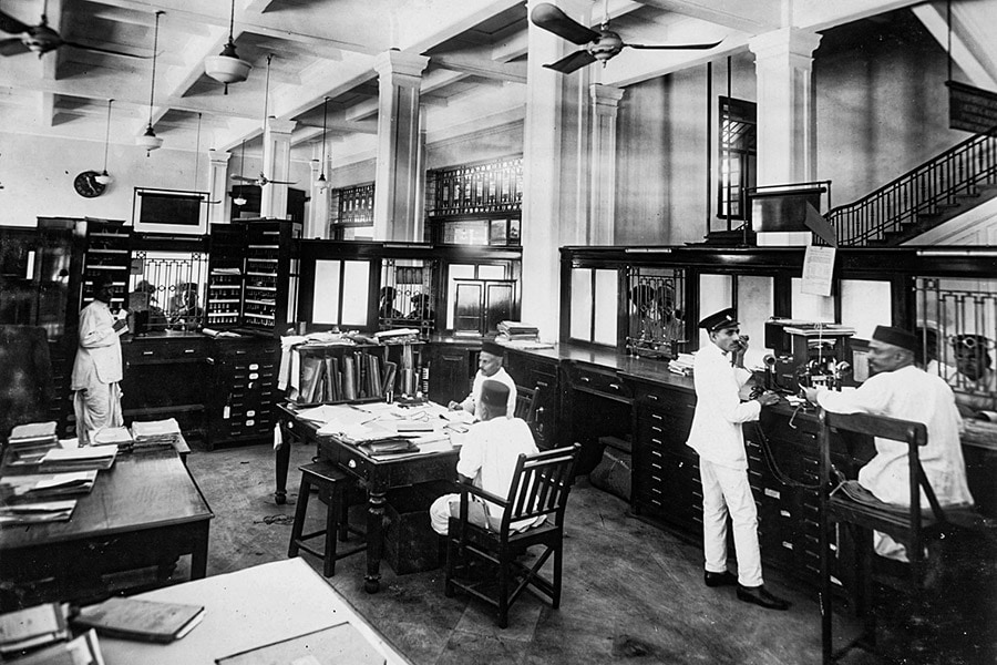 Indian clerical staff at the booking hall of the Victoria Terminus, Bombay, a terminus for the Great Indian Peninsula Railway, which by 1870 stretched all the way across India to Calcutta. Image: SSPL/Getty Images