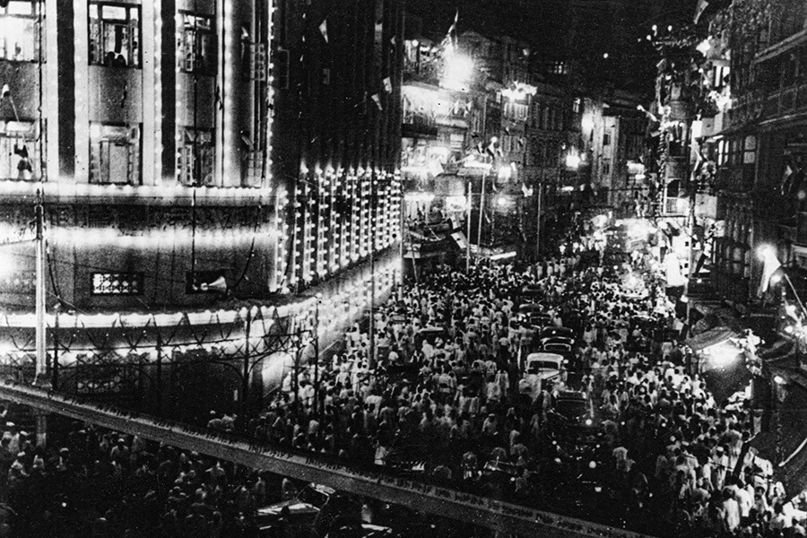 Crowds on streets of Bombay celebrate the handing over of power in India with illuminations and fireworks, August 21, 1947. Image: Central Press/GettyImages