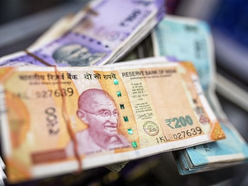 Morning Buzz: Rupee falls to weakest monthly close, Adani Green to raise Rs 12,400 crore, and more