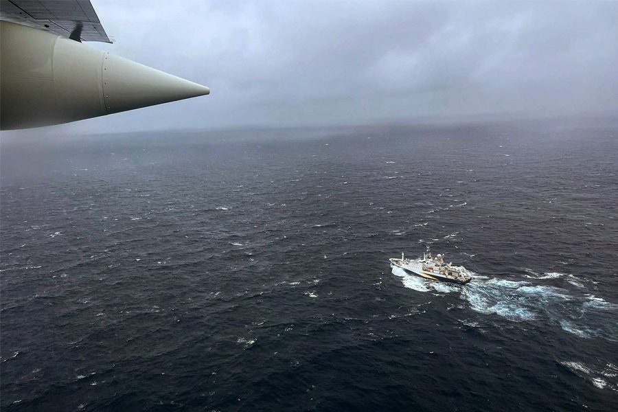 Hercules airplane flies over the French research vessel, L'Atalante approximately 900 miles East of Cape Cod during the search for the 21-foot submersible, Titan, June 21, 2023 over the Atlantic Ocean. The unified command is searching for five people after the Canadian research vessel Polar Prince lost contact with their submersible during a dive to the wreck of the Titanic on June 18, 2023.
Image: U.S. Coast Guard via Getty Images 