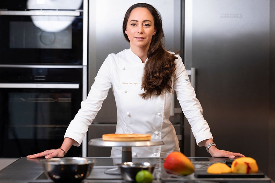 French World pastry champion Nina Metayer, poses during a photo session at her workshop in Issy-Les-Moulineaux, outside Paris, on November 6, 2023. Image: JOEL SAGET / AFP