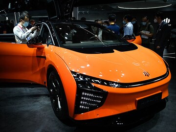 At Munich auto fair, you will find movie-projecting cars and a bike wash