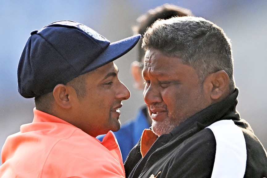 India's Sarfaraz Khan (L) greets his father before his debut match at the Niranjan Shah stadium formerly known as Saurashtra Cricket Association in Rajkot on February 15, 2024, before the start of third Test cricket match between India and England.
Image: Punit Paranjpe / AFP