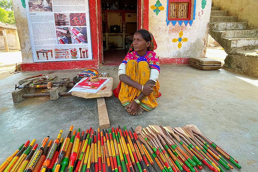 From rolling pins to spatulas, lacquer art on sale in Nirona village