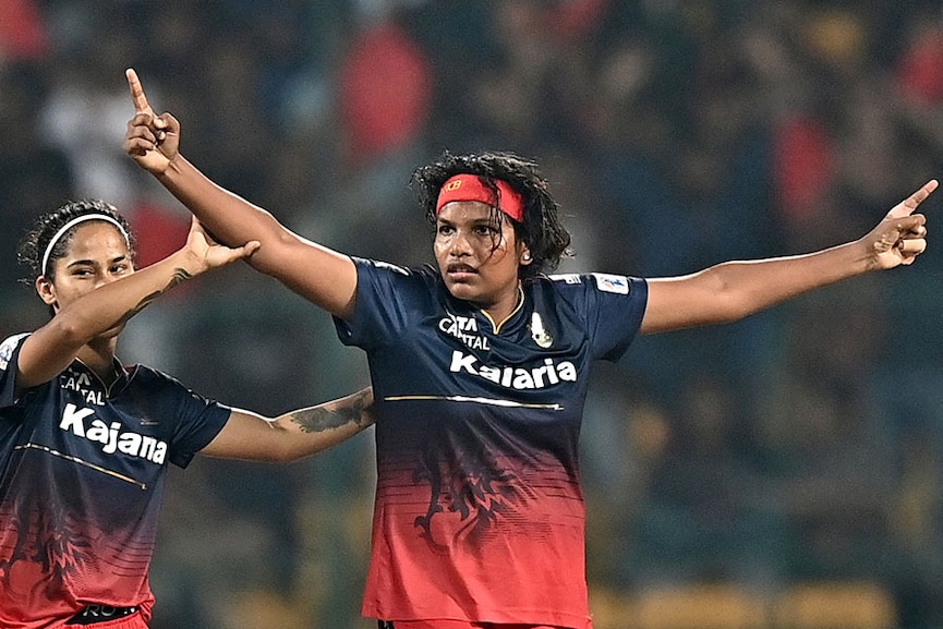 Royal Challengers Bangalore's Sobhana Asha (R) celebrates with team mates the dismissal of UP Warriorz's Shwetha Sehrawat during the Women's Premier League (WPL) Twenty20 cricket match between Royal Challengers Bangalore and UP Warriorz at the Chinnaswamy Stadium in Bengaluru on February 24, 2024. Image: Idrees Mohammed / AFP 