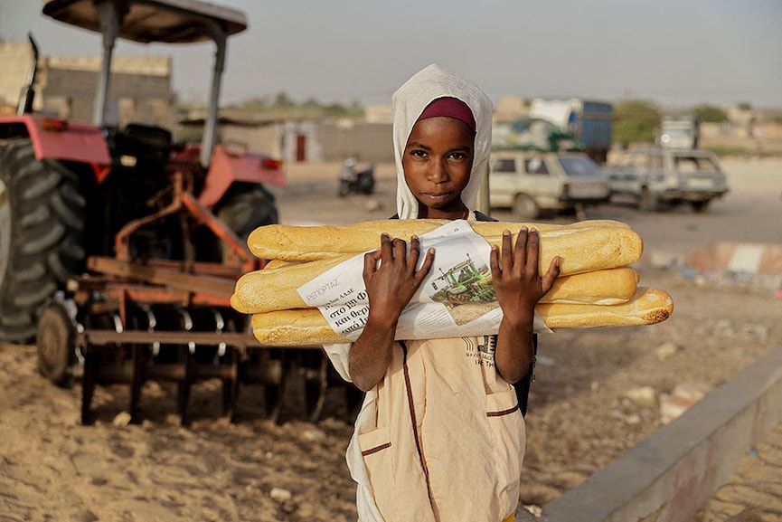 Hunger on the ground, rockets in the sky: Eyecatching photos of the week