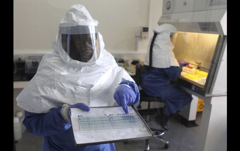 A doctor displays collected samples of the Ebola virus at the Centre for Disease Control in Entebbe,