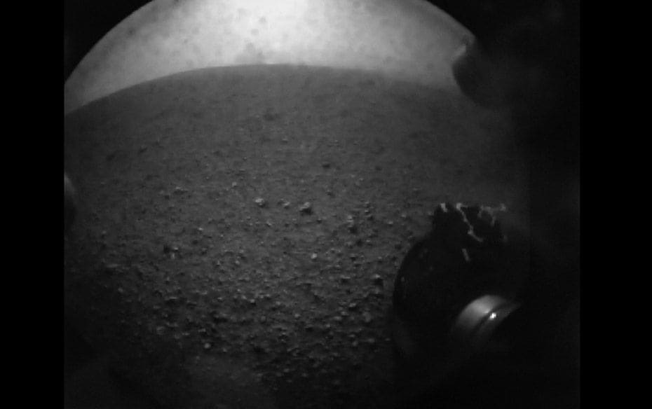 The picture of a wheel of Curiosity rover after it landed on Mars. The image, one of the first from 