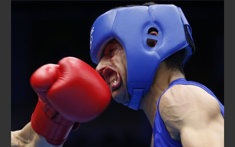 Nordine Oubaali of France (L) fights against Afghanistan's Ajmal Faisal in the men's Fly (52