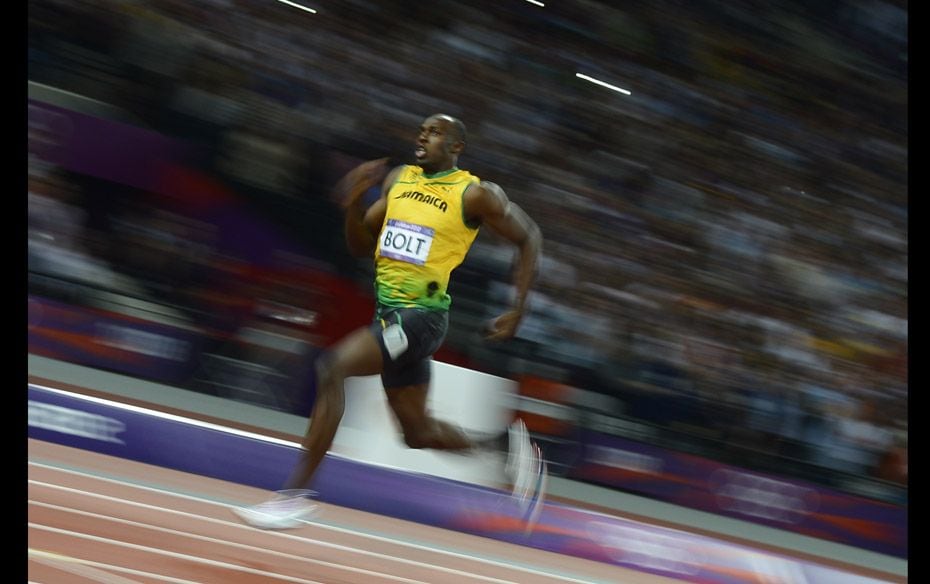 Jamaica’s Usain Bolt competes to win a gold medal in the final of the men’s 200m race at