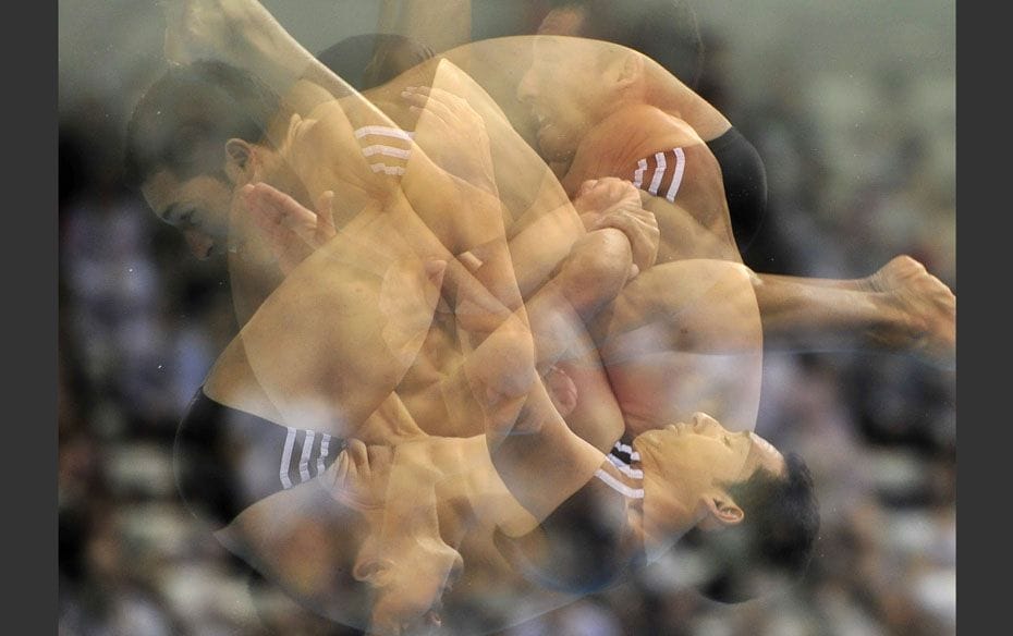 Jorge Luis Pupo of Cuba is photographed diving using an in-camera multiple exposure technique during