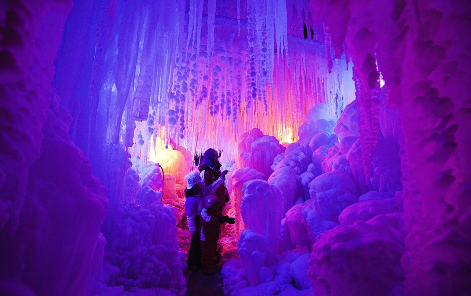 Visitors walk through an illuminated ‘ice palace’ in Schwarzsee near Bern               