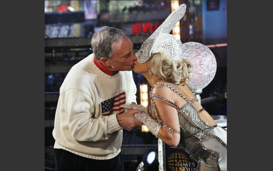 Singer Lady Gaga and New York City Mayor Michael Bloomberg kiss each other during celebrations at th