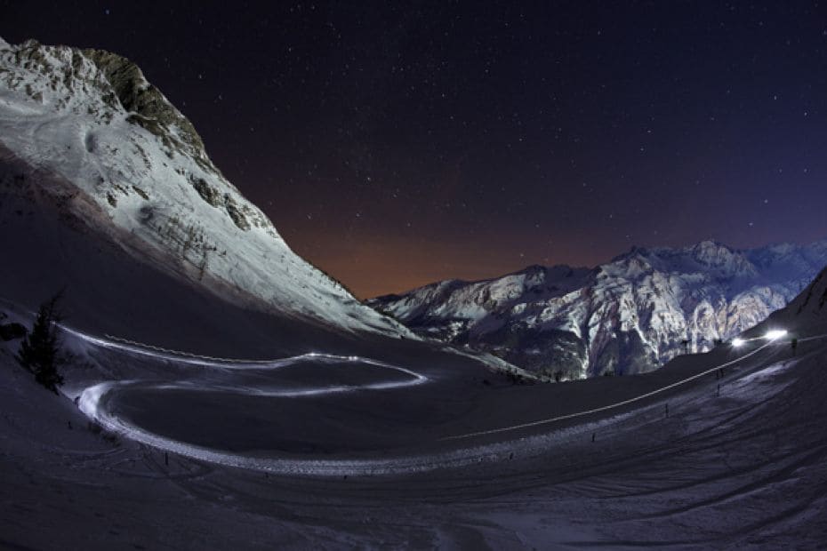 A musher and his dogs compete on a track near the Mont-Cenis Path during the ninth stage of La Grand