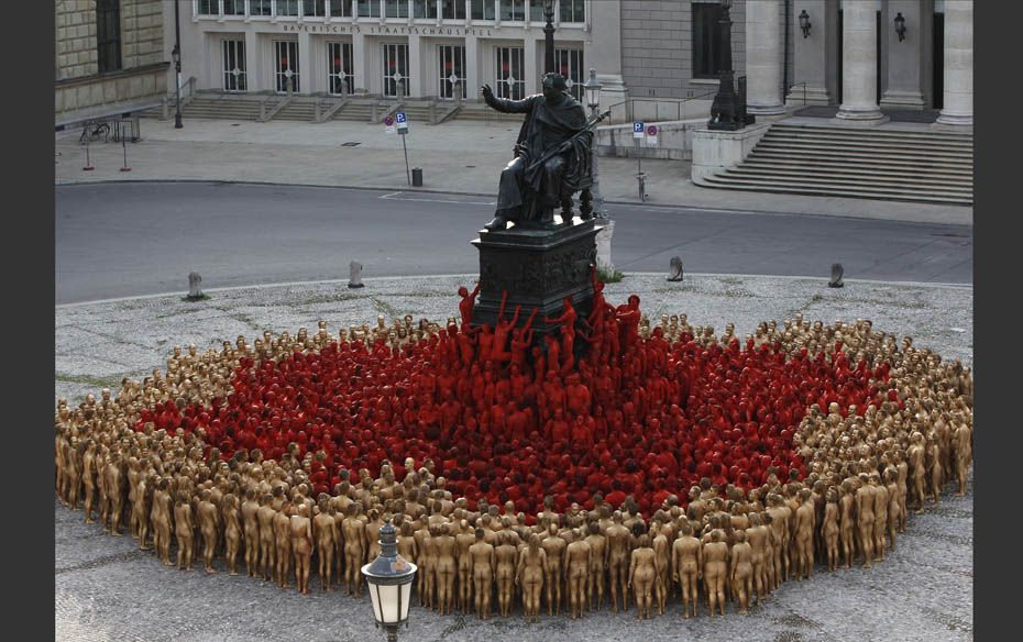 Around 1,700 naked volunteers pose for American artist Spencer Tunick in downtown Munich            