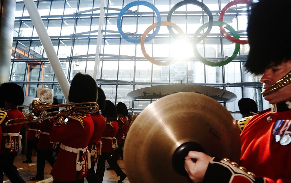 Bandsmen of the Irish Guards play during an unveiling ceremony for Olympic Rings in the Terminal Fiv