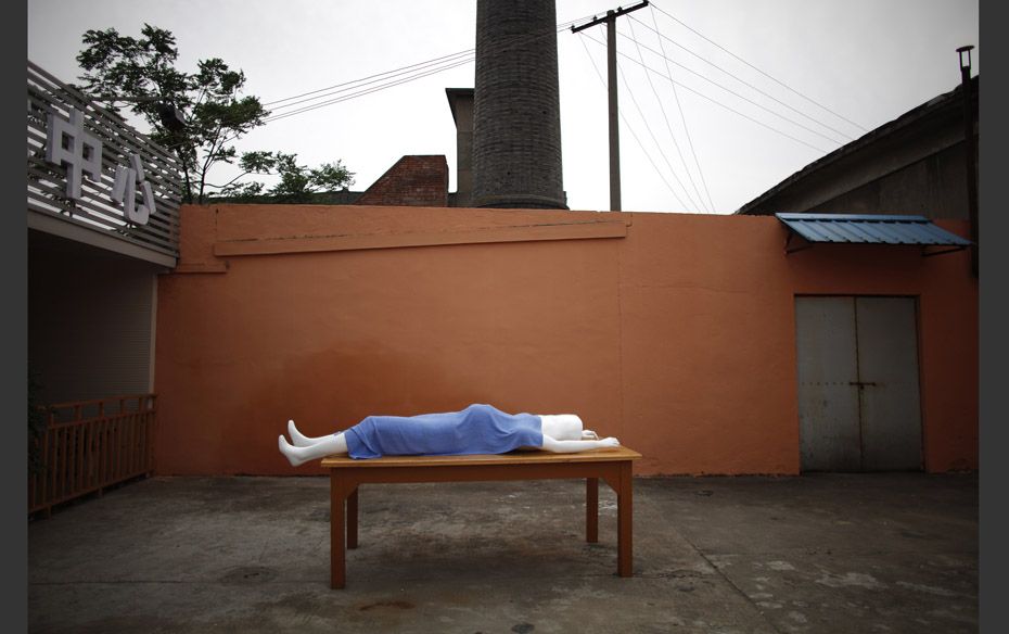 A plastic mannequin to be used for undertaker service class is seen outside of the Tianquanjiajing F