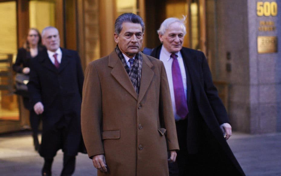 Rajat Gupta (C) exits the Manhattan Federal Court with his lawyers after attending a pre-trial heari