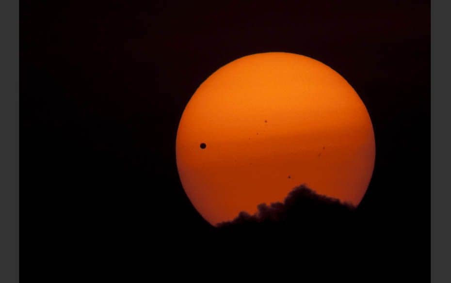 The planet Venus makes its transit across the Sun as seen from Kathmandu June 6, 2012. Venus made a 