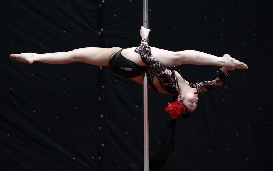 Contestant Zhu Wen competes during the 2nd China Pole Dance semi-final in Tianjin              