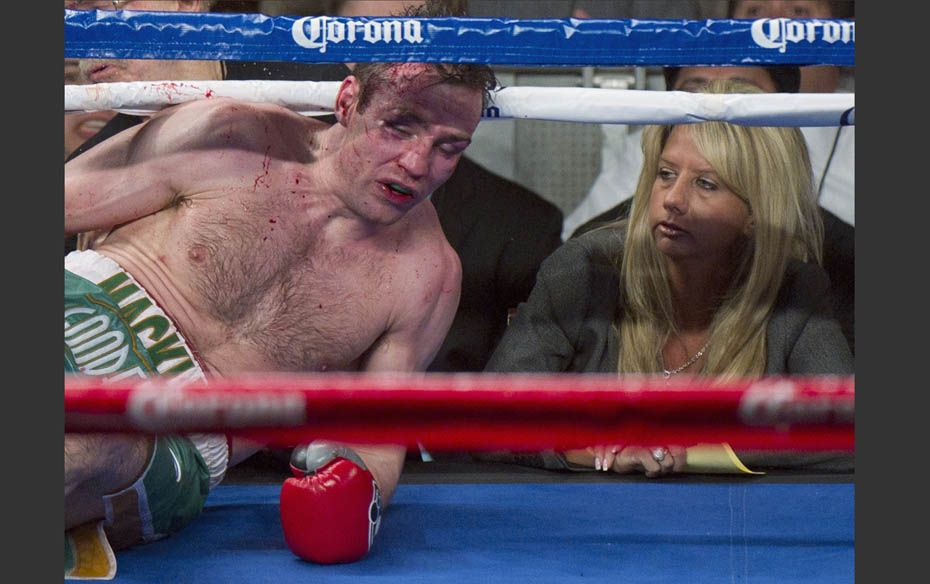 Matthew Macklin, from Ireland, lands on the ropes after he was knocked down by a punch from Sergio M