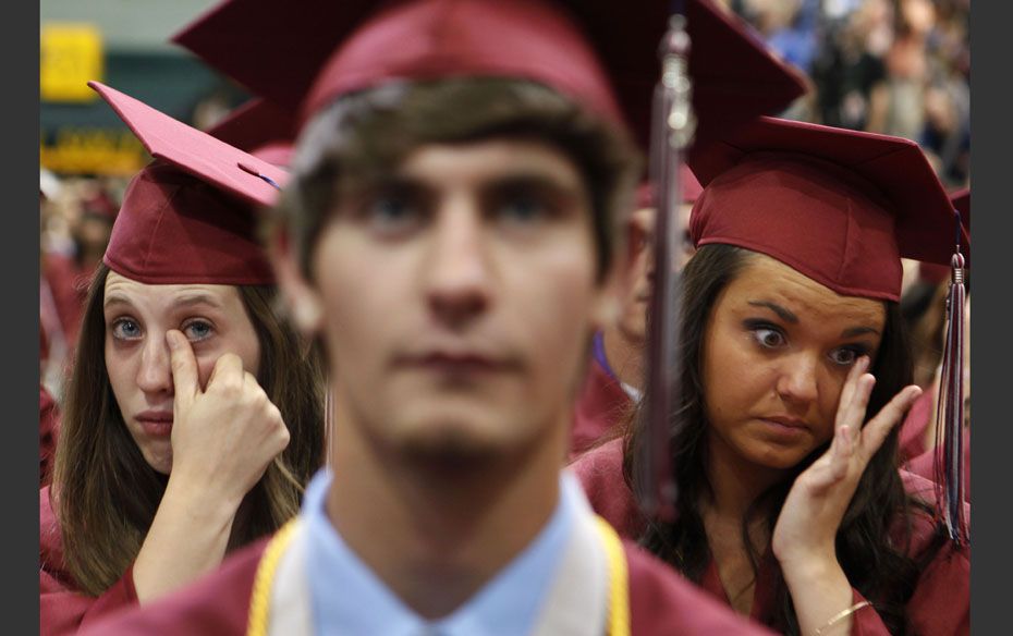 Students show emotions at the 2012 Joplin High School commencement ceremony inside the Leggett and P