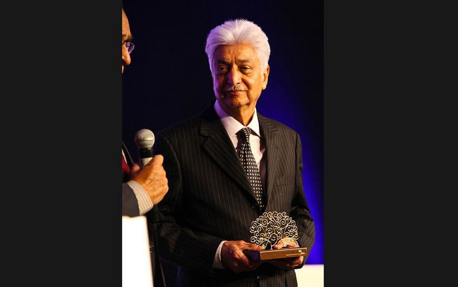 Azim Premji, chairman of Wipro, and winner of the flagship award, Outstanding Philanthropist, holdin